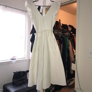 White dress with ruffles.